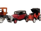 many toy cars that are lined up in a row