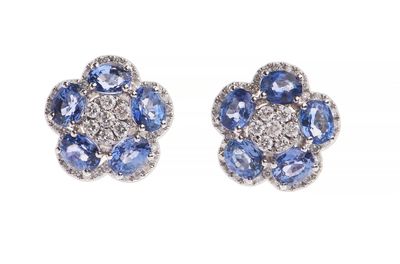 a pair of blue and white sapphire and diamond earrings