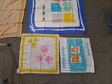 several different colored towels are laid out on the floor