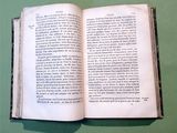 an open book that is sitting on a table