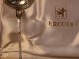 a silver spoon and fork in a box on a table