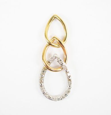 a close up of two gold and silver rings on a white background