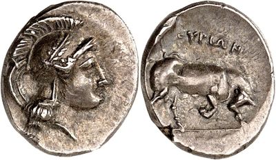a silver coin with an image of a woman and a goat