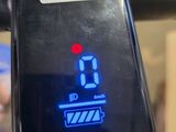 a close up of a bike ' s display on the handlebar