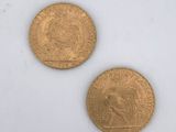 two gold coins, one of which is a sovereign and the other of which is a sovereign