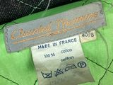the label of a green quilted jacket is on the label of a green quilted jacket