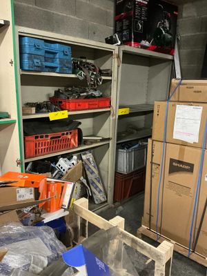 a room with a lot of boxes and boxes on the shelves