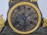a clock that is sitting on top of a table