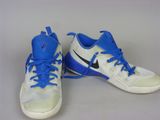 pair of white and blue sneakers with blue laces on them