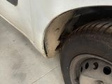 a white truck that has a flat tire on it