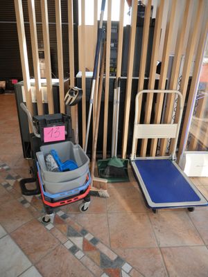 a luggage cart with a luggage bag and a luggage cart with a luggage bag on it