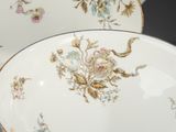 a bowl and a plate with flowers on it