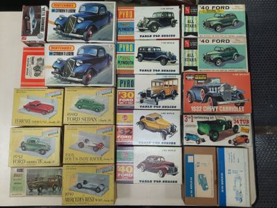 a lot of old model cars on display on a table