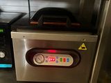a small oven sitting on a counter in a kitchen