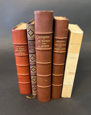 three books are stacked on top of each other on a table