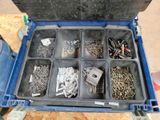 many different types of screws and nuts in a tool box