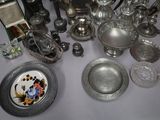 a table with a lot of silver items on it