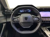 the interior of a car with a steering wheel and dashboard