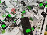 a pile of assorted cell phones on a table