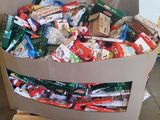 a box full of candy and candy bars on a pallet