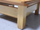 a wooden table with a bowl on top of it