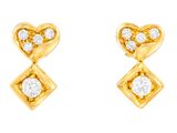 a pair of gold and diamond earrings