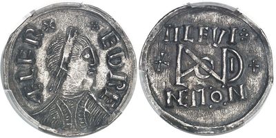 a close up of a coin with a woman ' s face on it