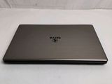 a laptop that is sitting on a white surface
