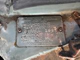 a metal plaque on the floor of a car