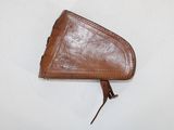 brown leather triangle shaped purse on a white surface