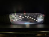 a picture of a car ' s dashboard with a display on it