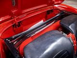 a close up of a red car with its hood open
