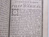 an open book with a black and white image of a page in it