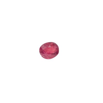 a close up of a pink sapphire stone on a white background