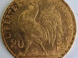 l'image d'une pièce d'or ornée d'un coq