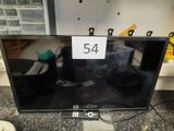 un téléviseur à écran plat posé sur le comptoir, avec une étiquette de prix