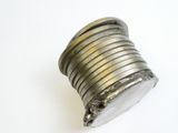 a metal object that is sitting on a white surface