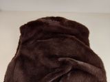 brown faux fur blanket on a white surface