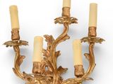 an image of a golden candle holder with four candles on it