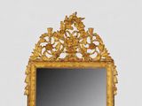 a mirror that is sitting on the wall in the room