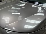 a close up of a car with a sticker on the hood