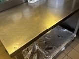 a table that has a bucket on it in the kitchen