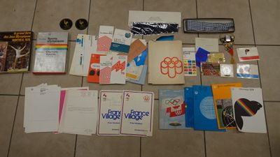 a lot of books and other items on the floor
