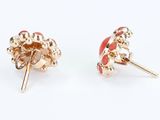 two pairs of red and gold earrings on a white background