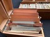 a wooden box filled with lots of files and papers