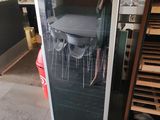 a refrigerator that has a picture of a table and chairs on it