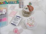 a table that has a bunch of craft supplies on it