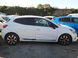 a white car parked in a lot next to other cars