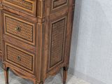 a wooden cabinet with a marble top in a room