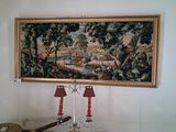 a picture of a painting hanging on the wall above a table